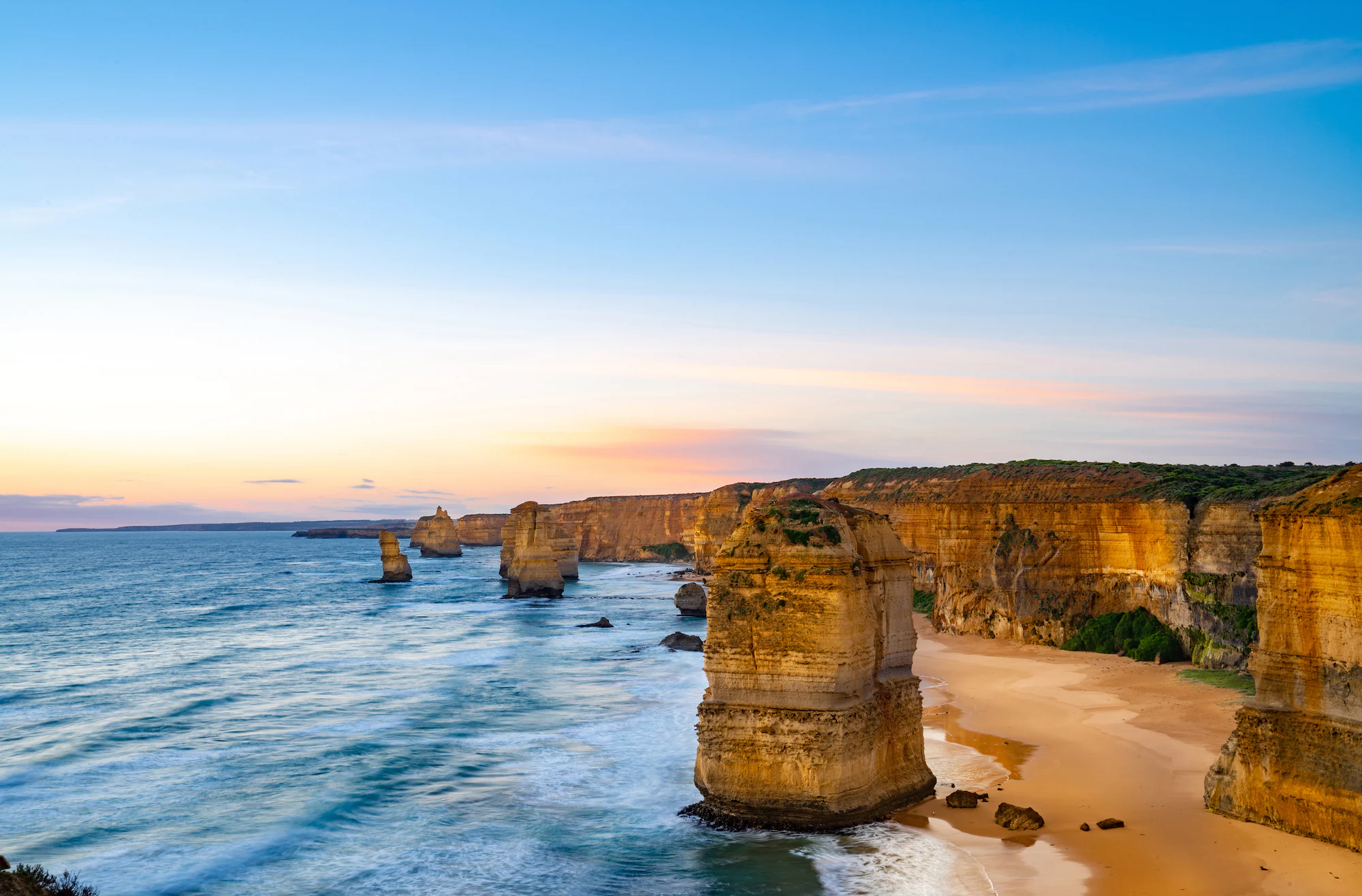 Blue skies across the horizon at the Twelve Apostles