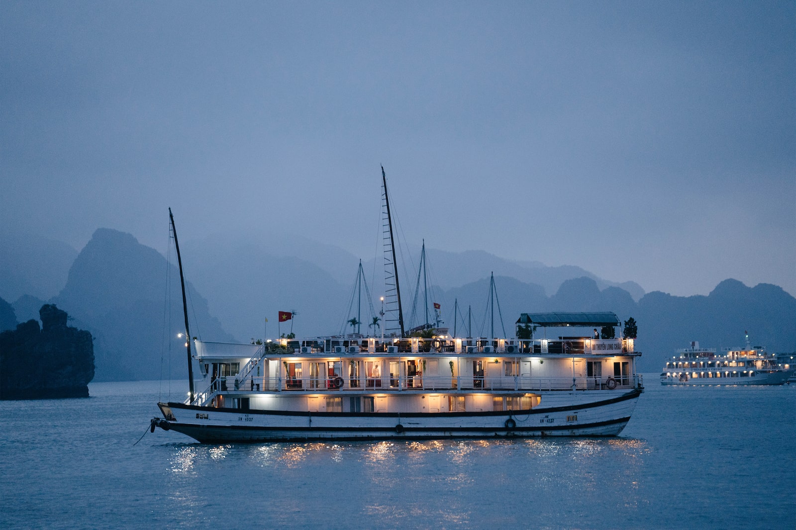 Ha Long Bay illuminated boat at sea