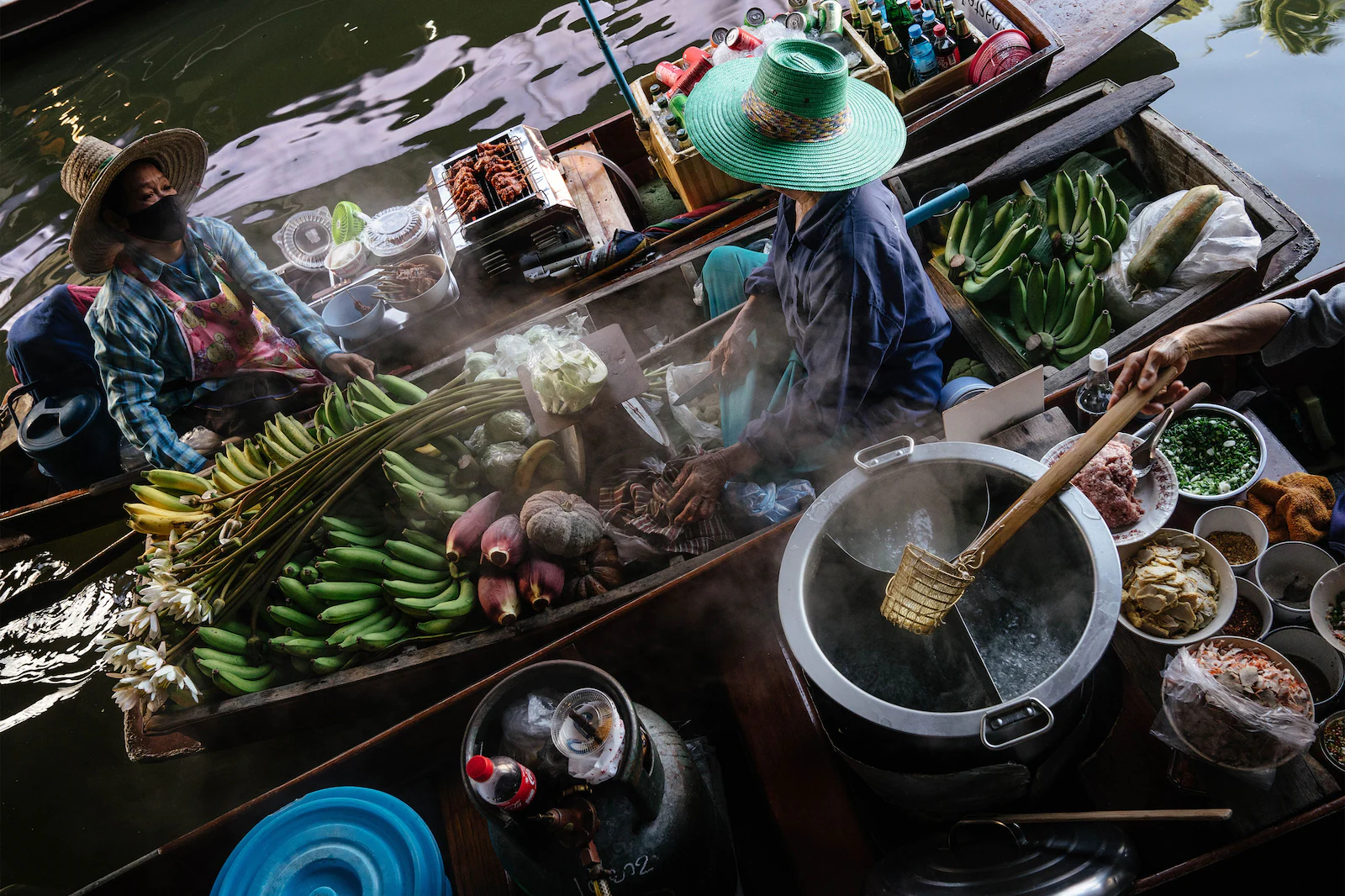 Loaded sampan boats in the floating market