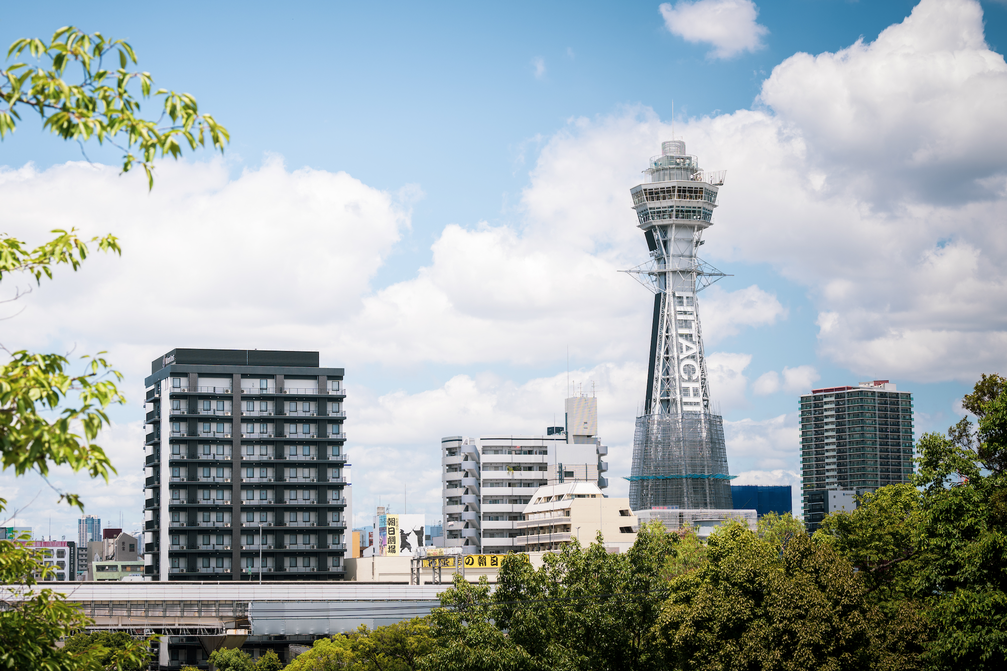 View of Hitachi Tsutenkaku Tower and the surrounding buildings at a distance